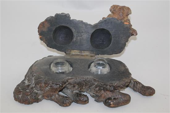 A late 19th / early 20th century Black Forest carved double inkwell, 12in.